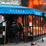 Manifestantes ateiam fogo em restaurante e confrontam a polícia durante protestos na França; veja FOTOS e VÍDEOS